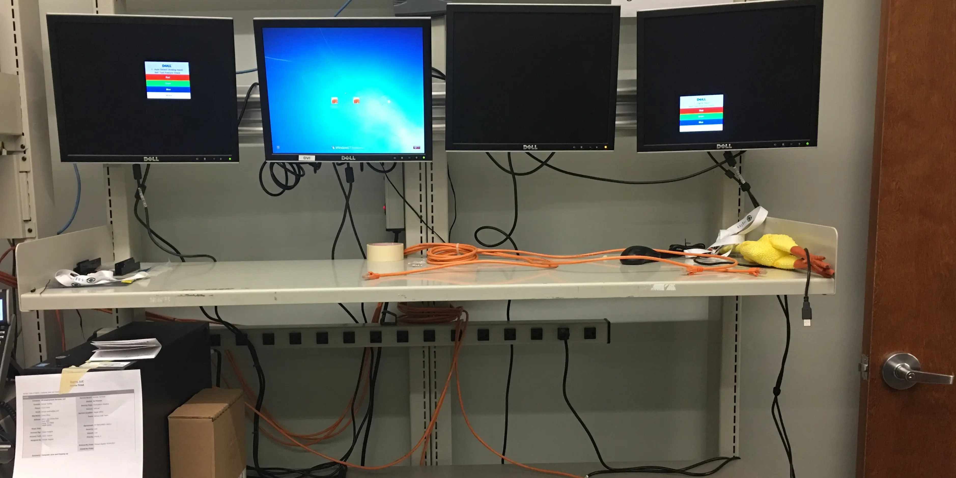 A series of monitors in a computer lab